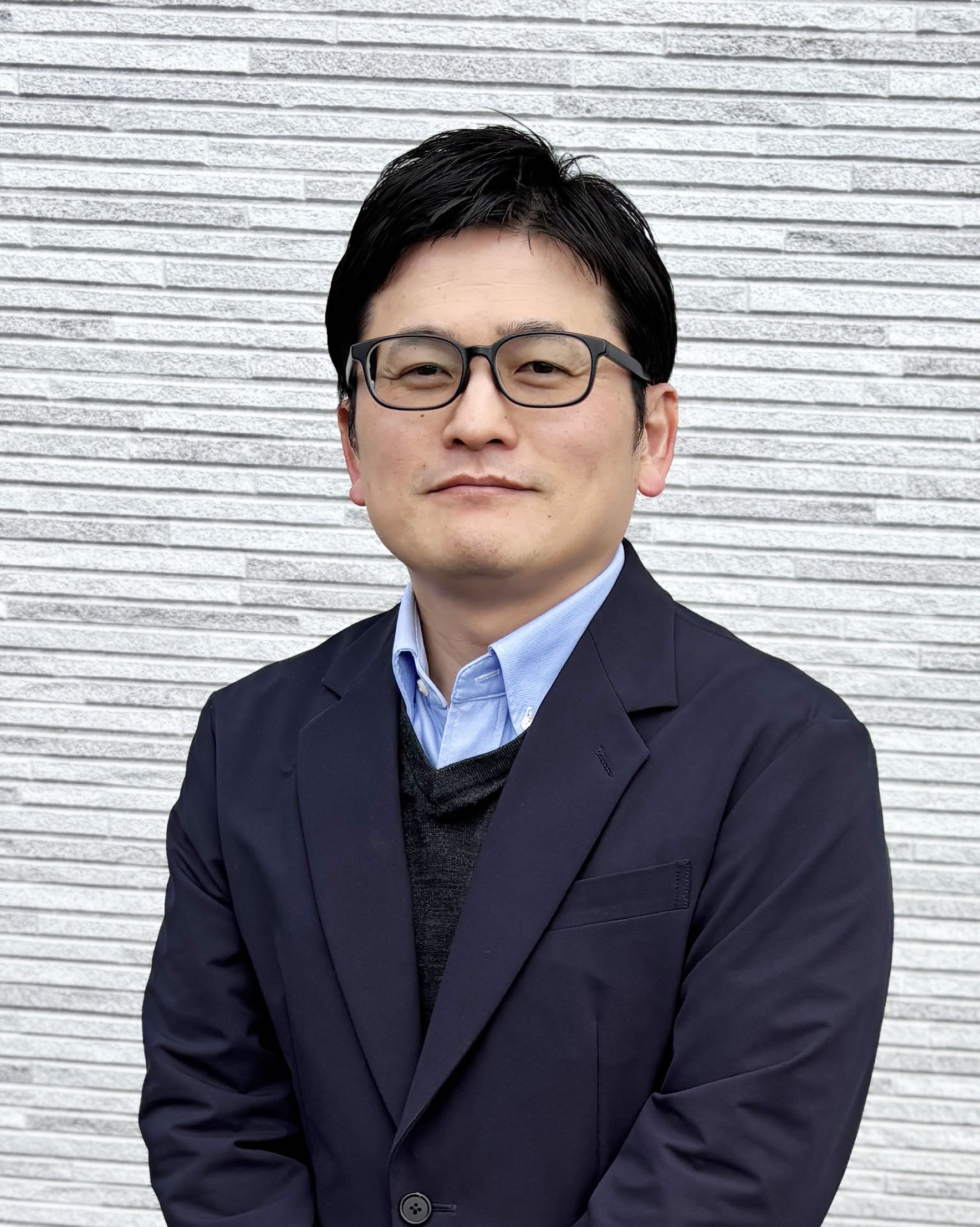 スガサポ代表 菅谷秀仁の顔写真